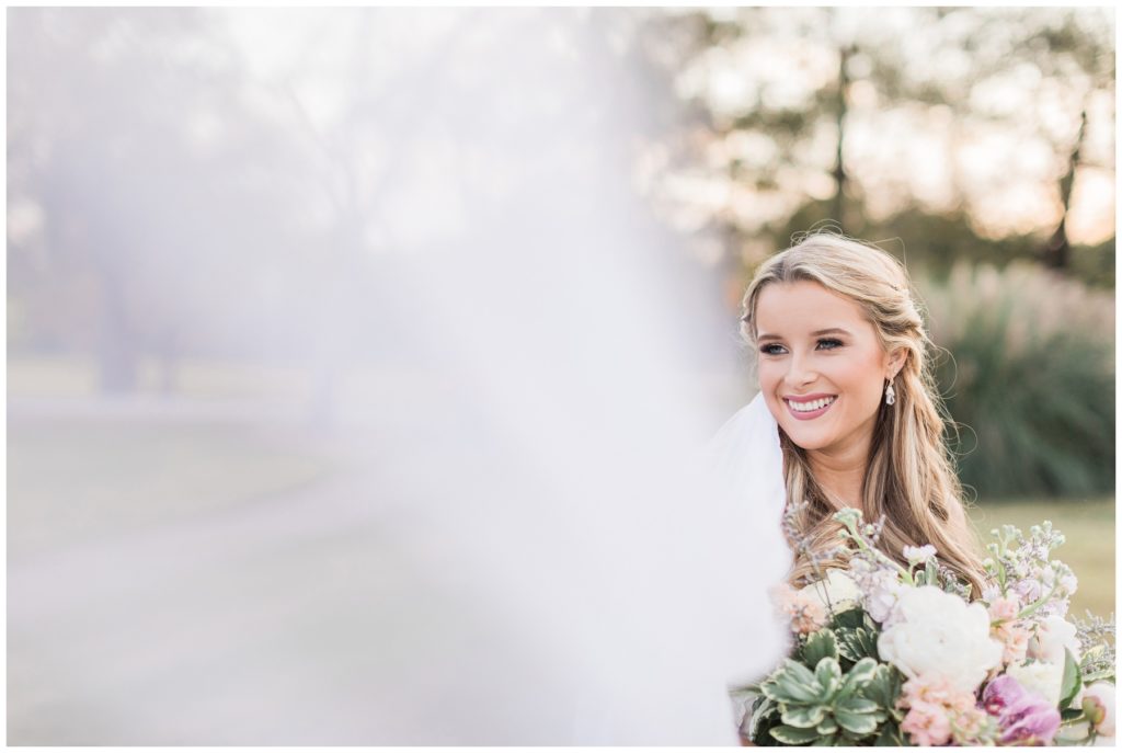 Smiling bride with veil