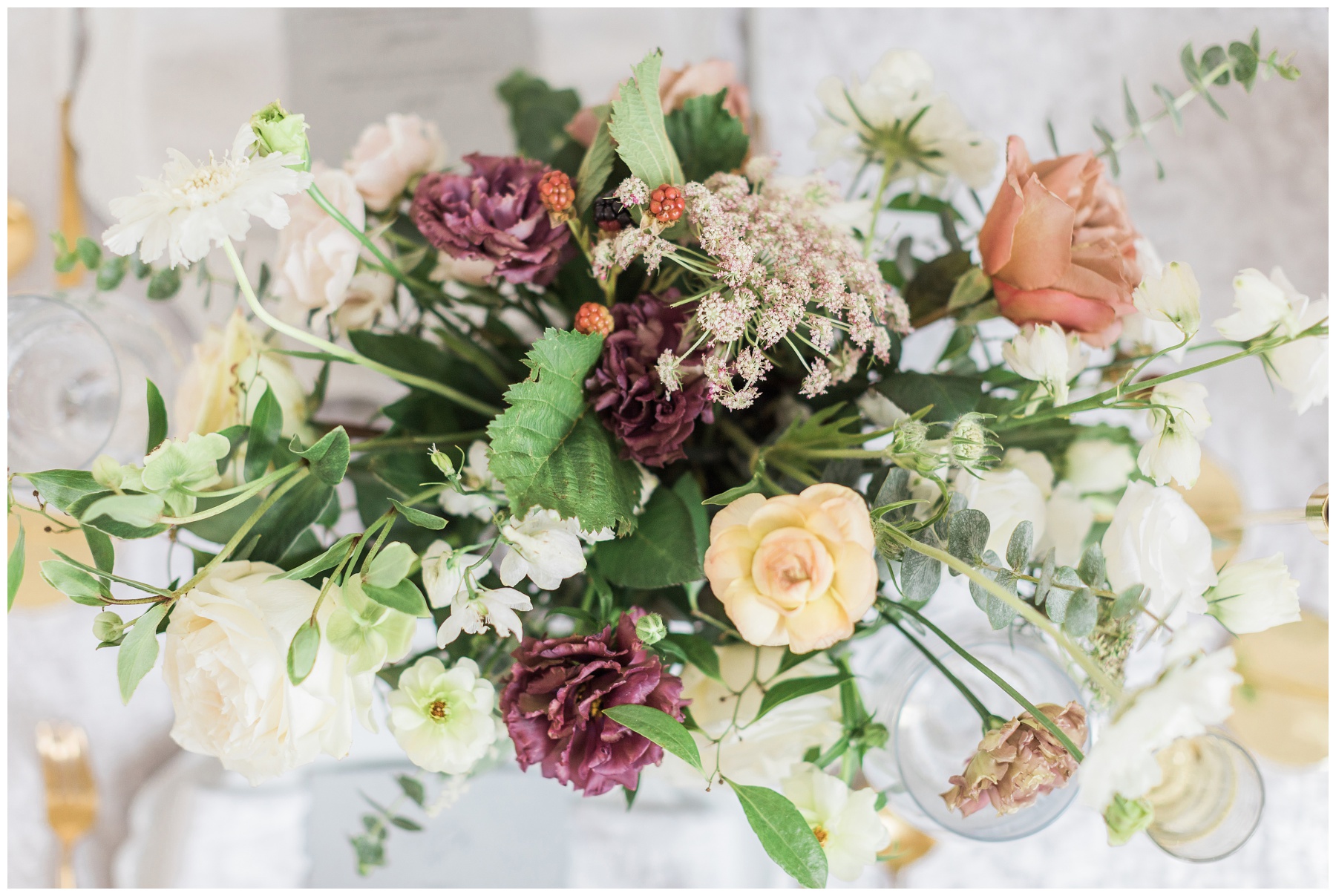 Lush bridal bouquet with garden roses, scabiosa, hellebore and greenery