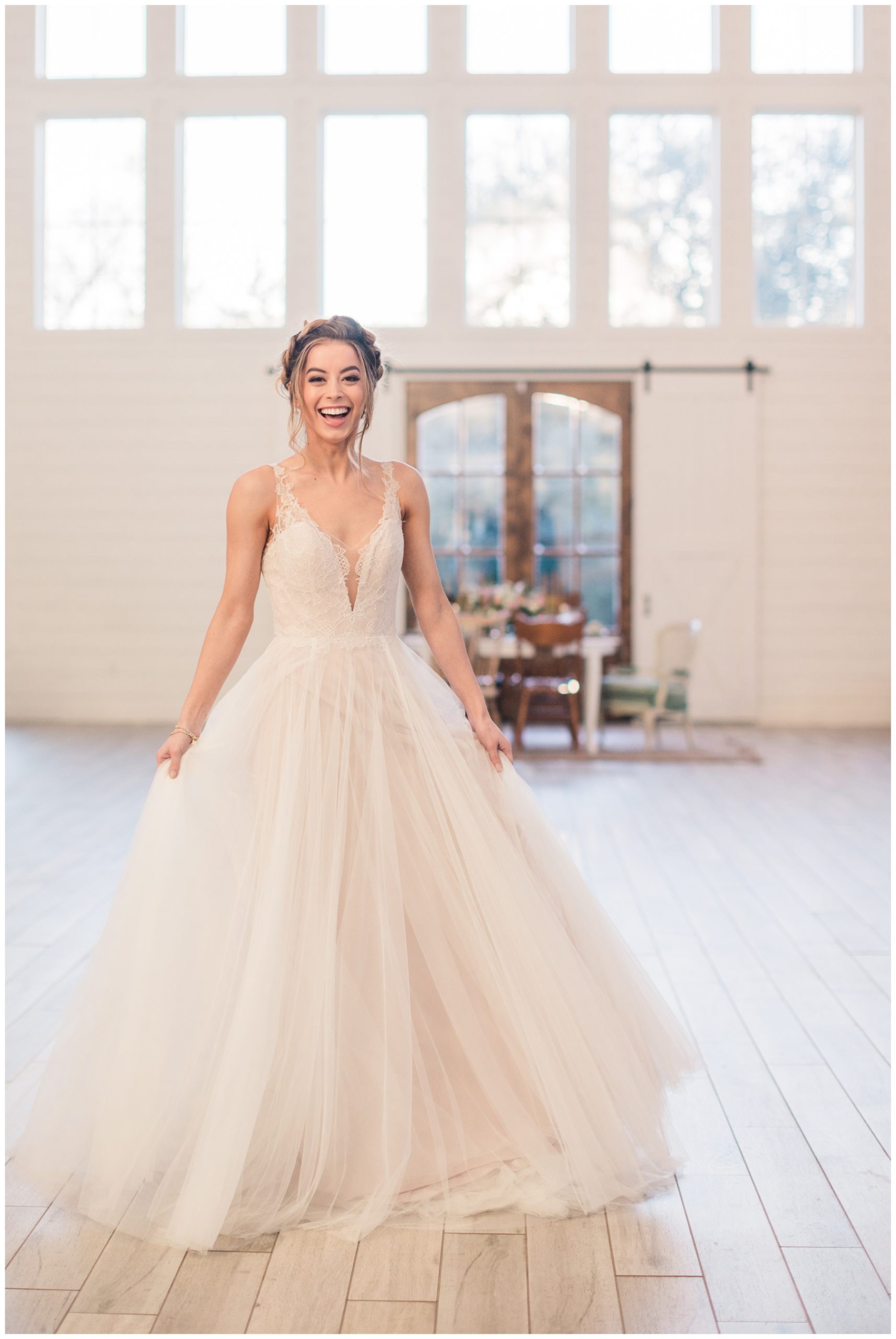 Bride in a BHLDN gown with deep v neckline and tulle skirt