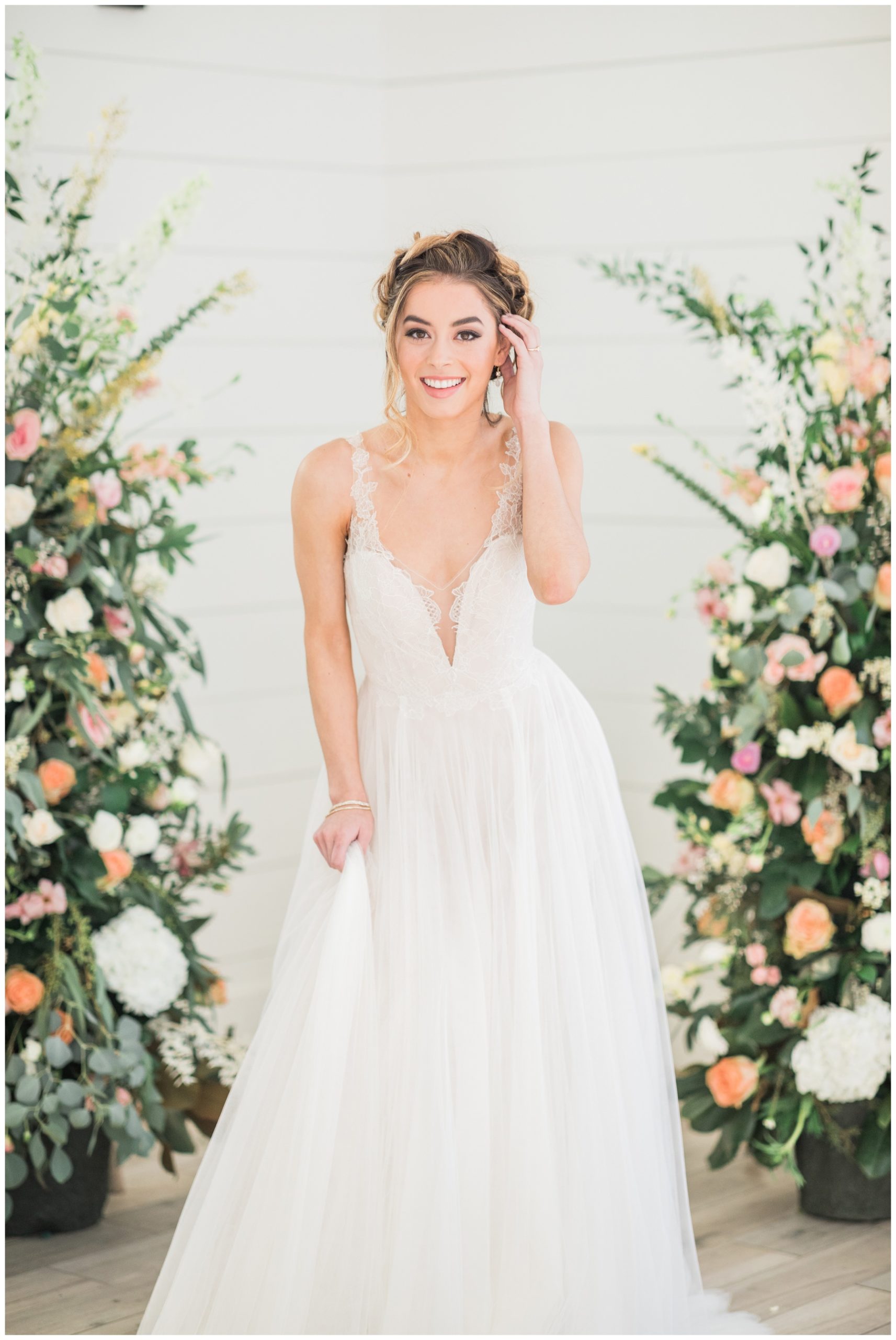 Bride in a BHLDN gown with deep v neckline and tulle skirt