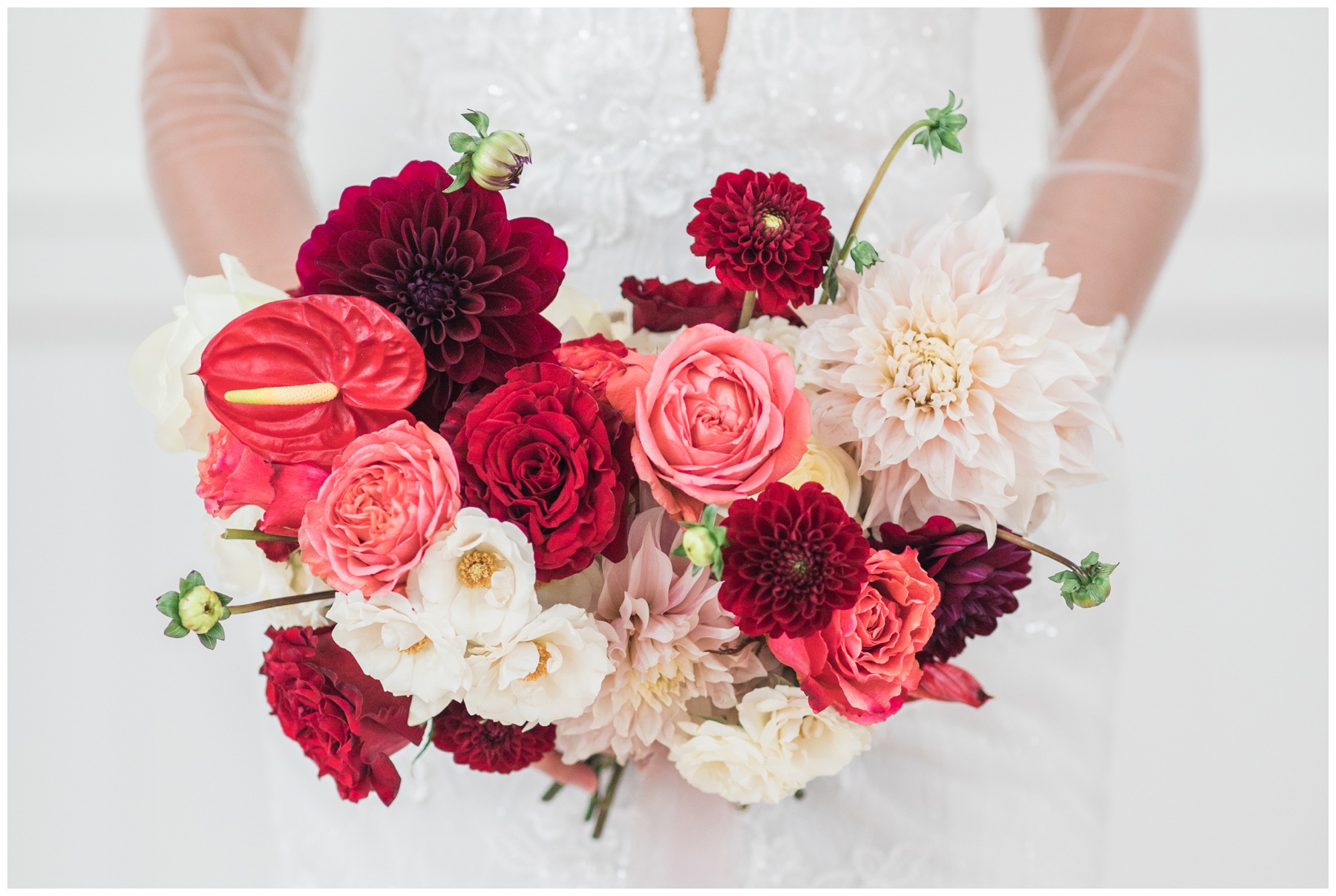 Bride with a red and pink bouquet