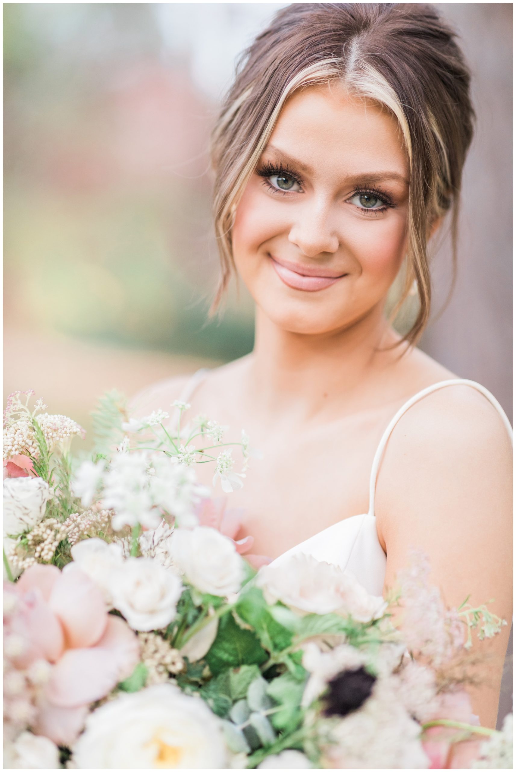 Bride wearing glam makeup and her hair in an updo