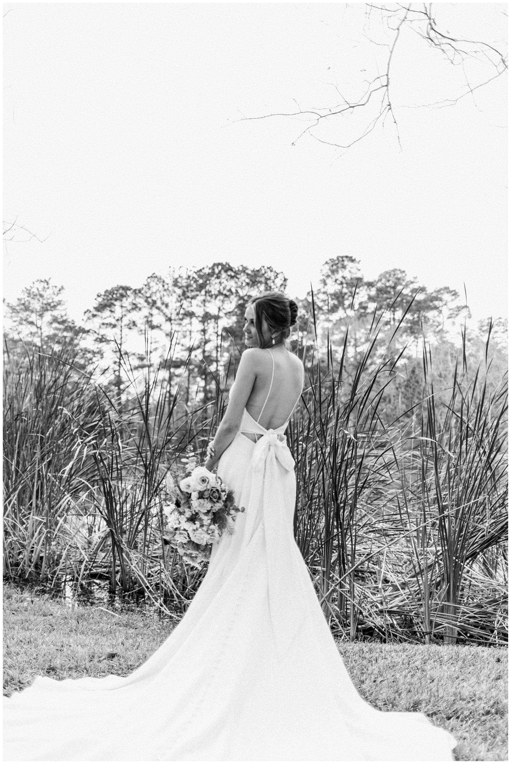 Bride in a Parvani Vida gown with a low back and mermaid skirt