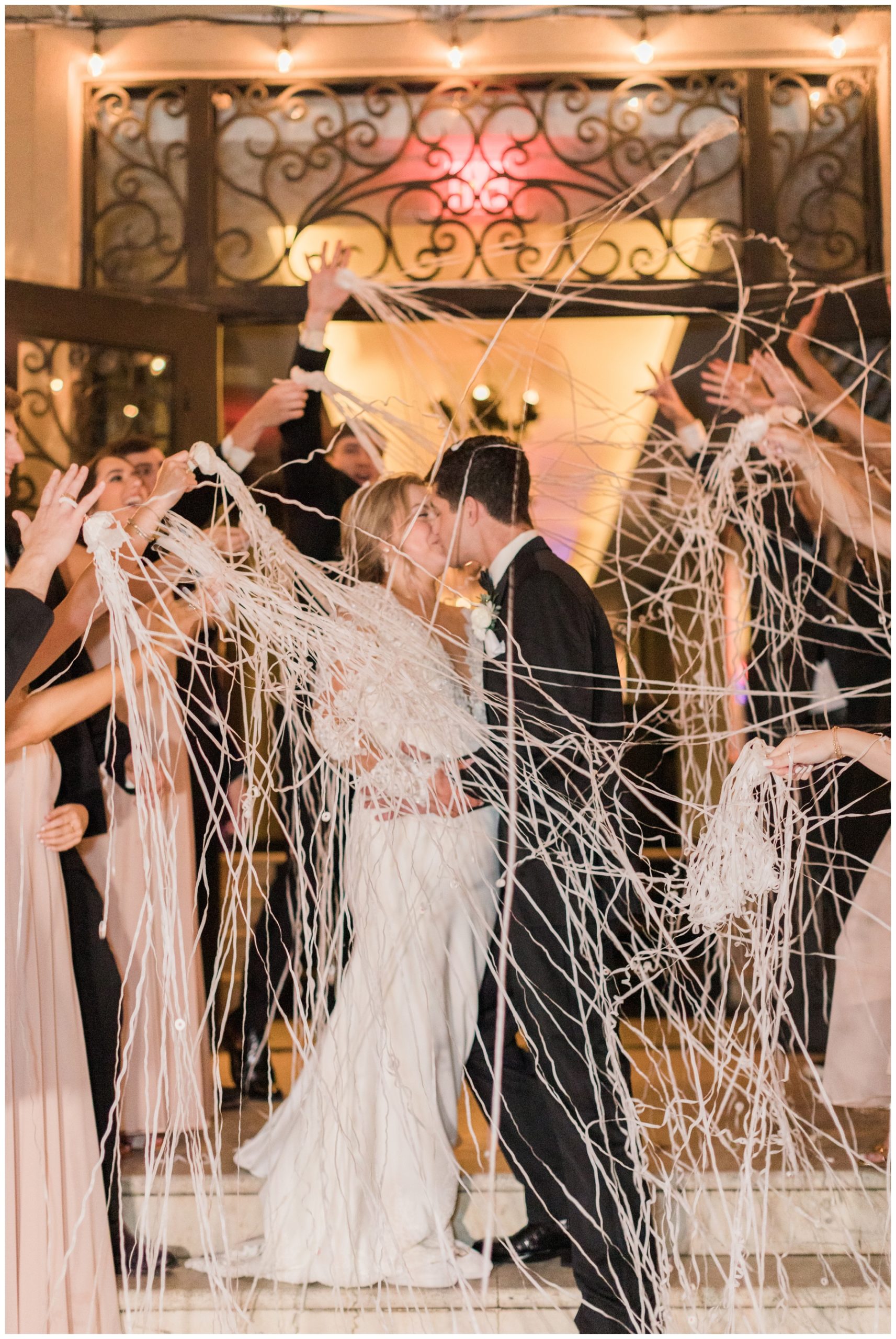 Bride and groom exit with silly string