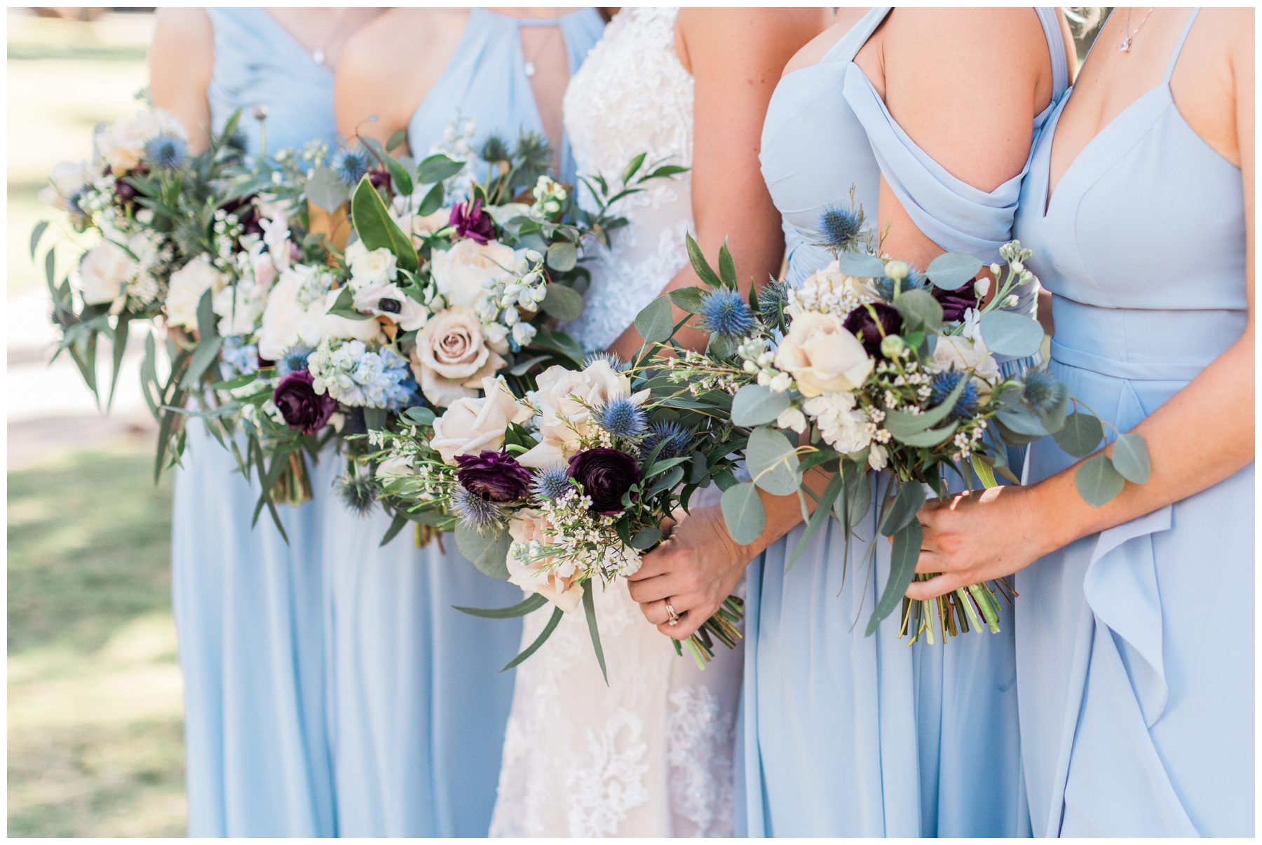 Bridal bouquet filled with pale pink roses, blue delphinium, and blue thistle by Urban Rubbish