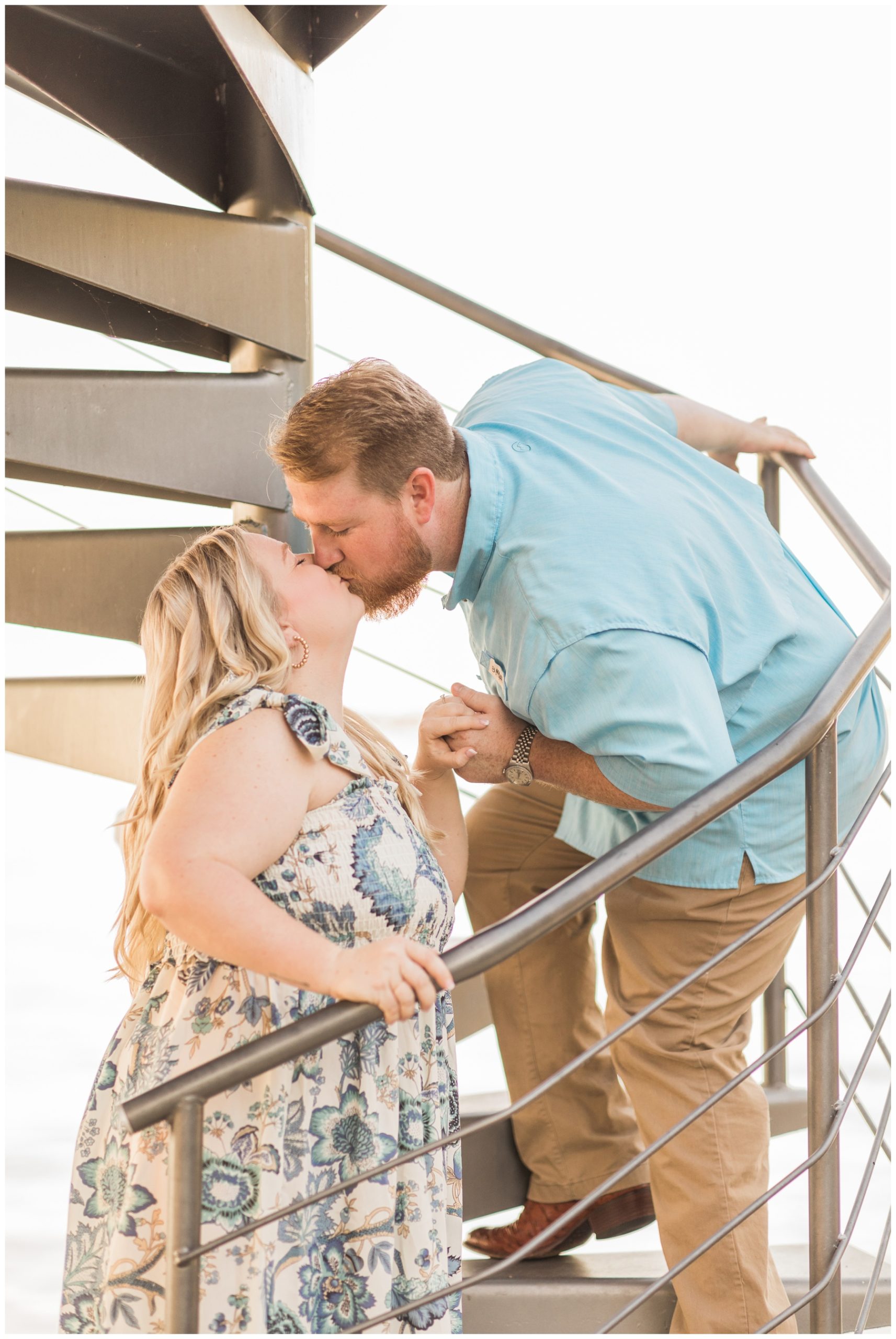 Bride and groom climbing lighthouse stairs for their Lake Conroe engagement session