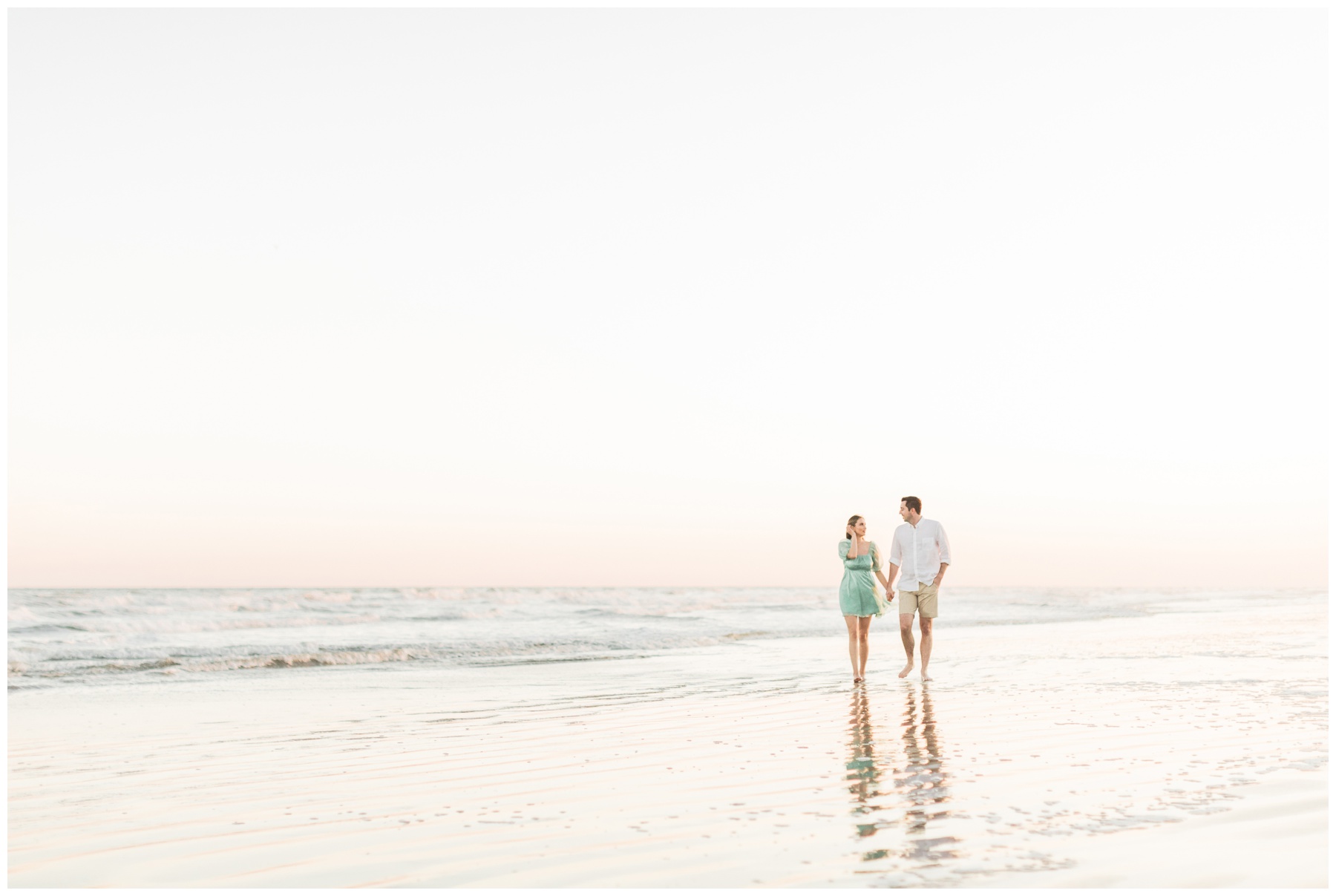 Couple walking on the beach at Galveston Island State Park