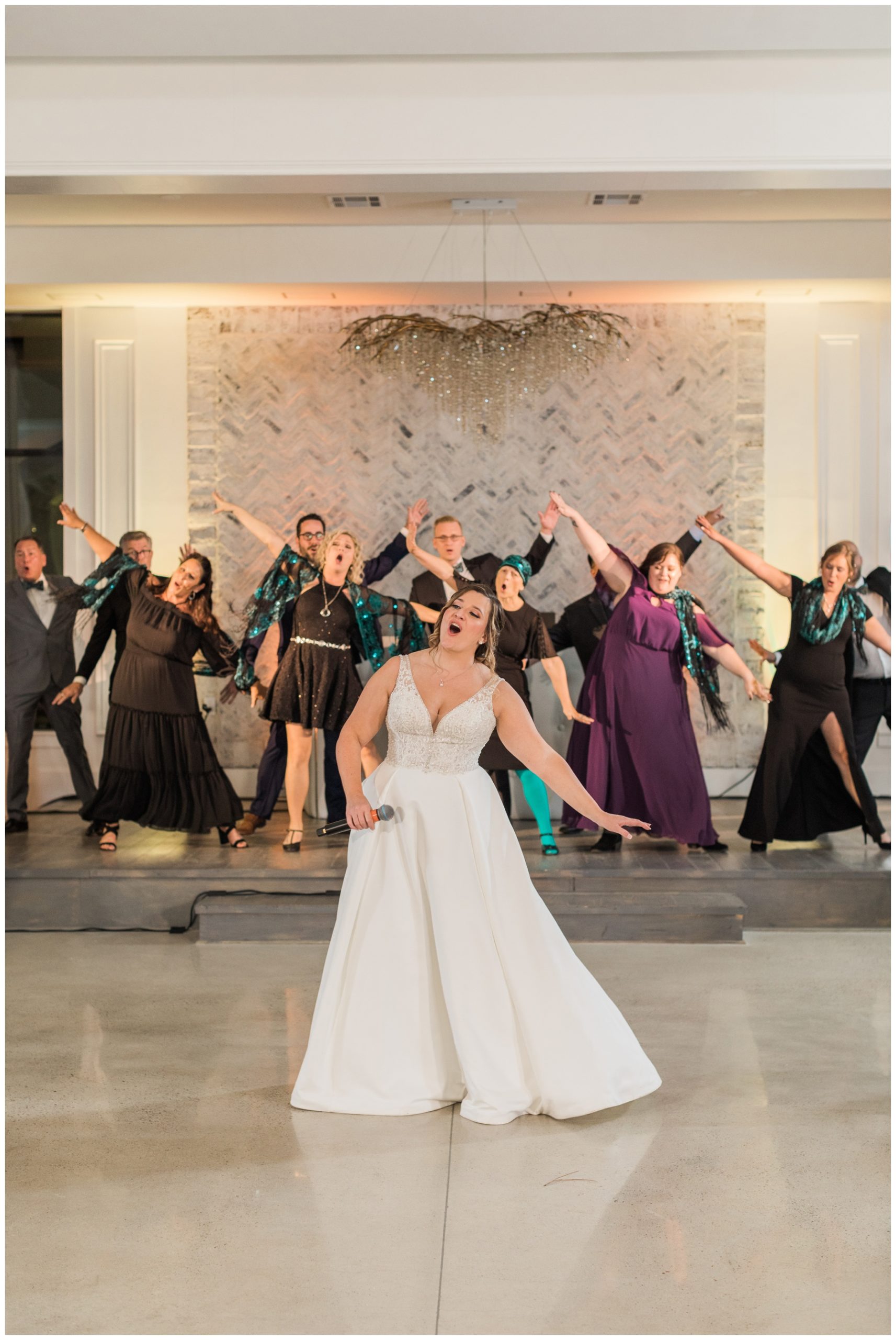 Bride performing with her show choir at her wedding reception